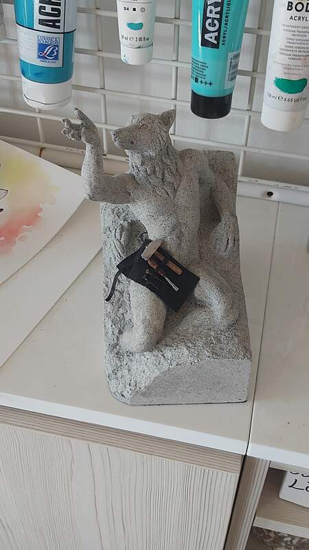 art sculpture furry wolf art nsfw and a stone chiselling kit as a coverage for the sculptures nudity 